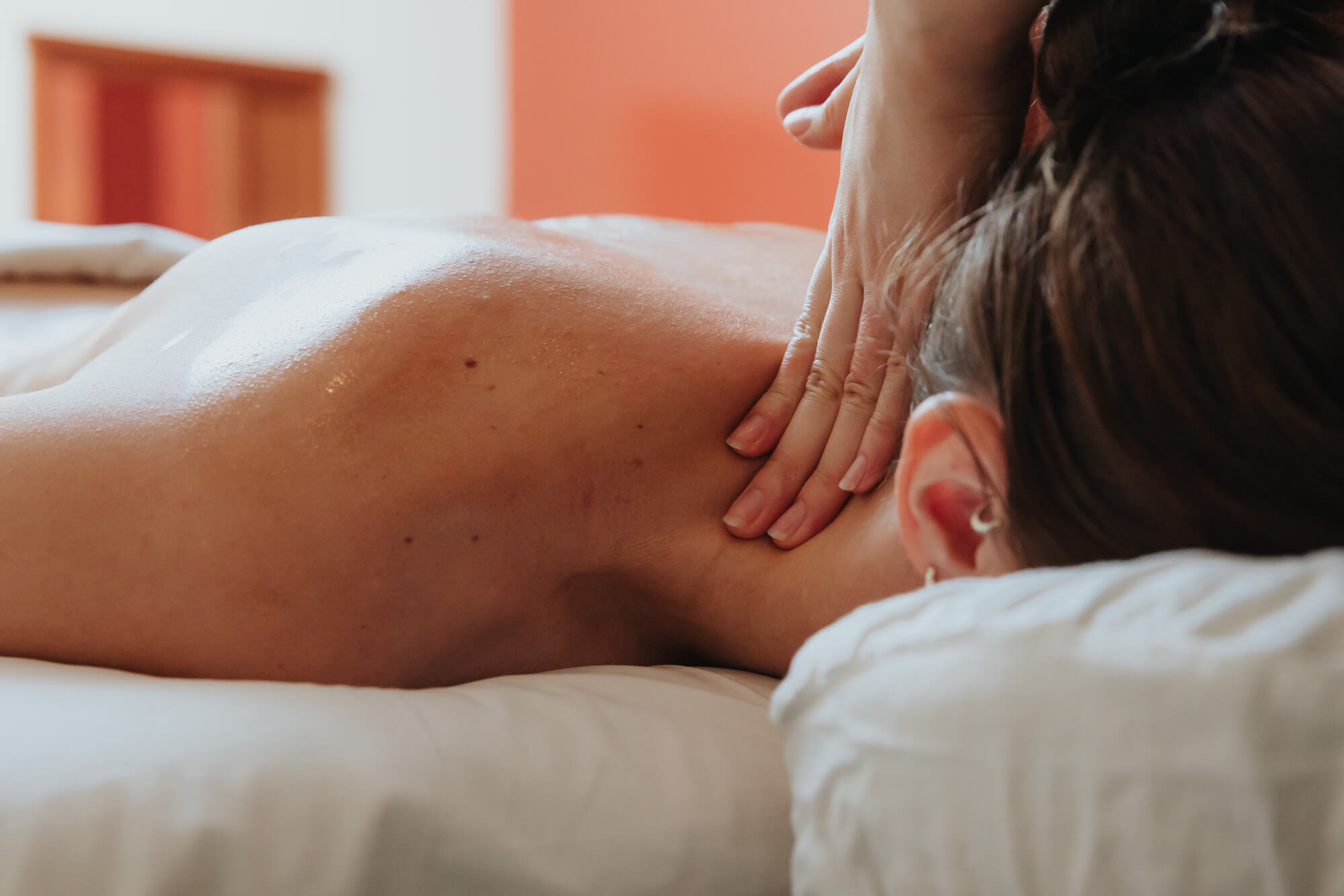 A woman receiving a neck massage