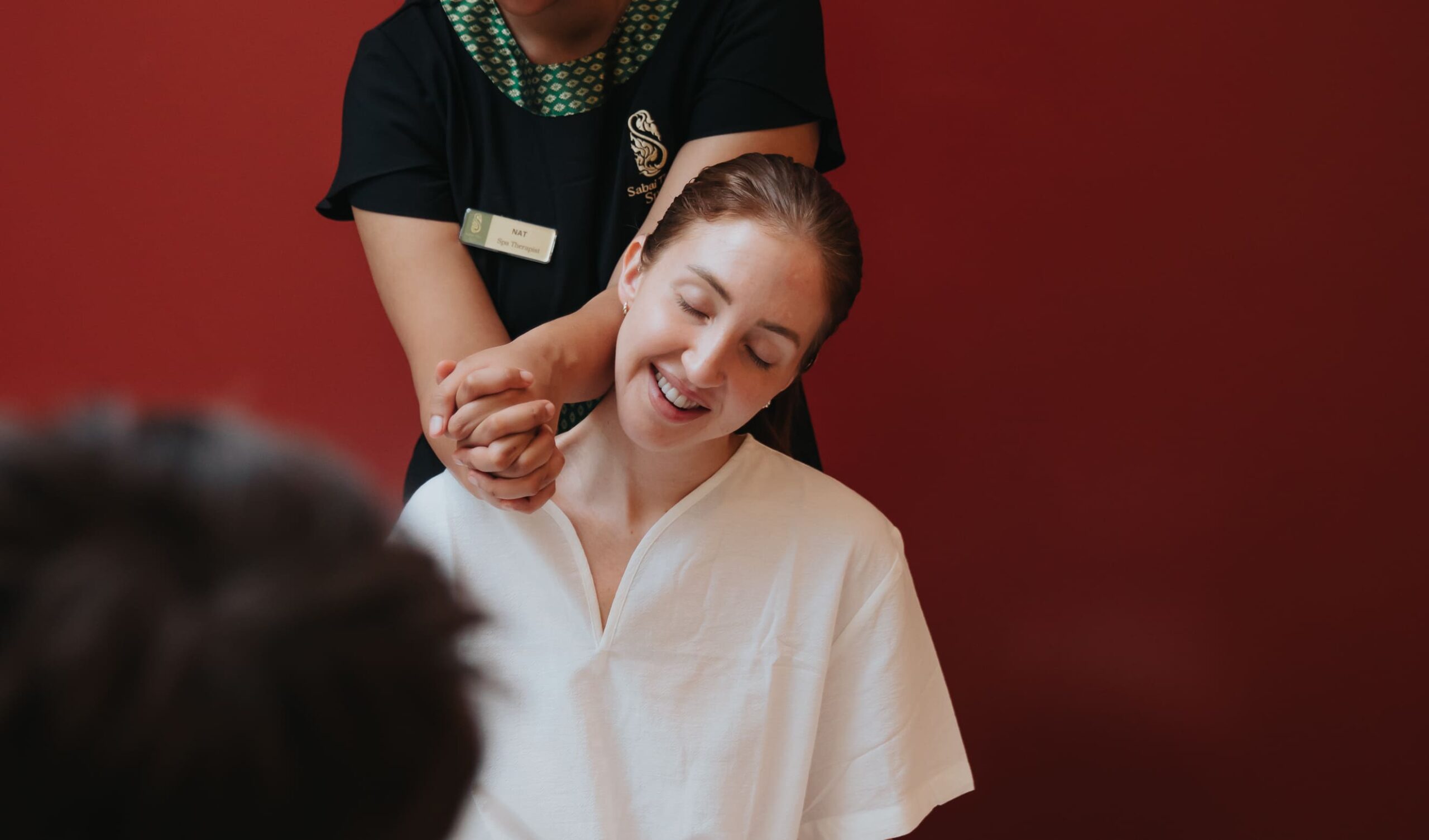woman enjoying a shoulder massage at Sabai Thai Spa