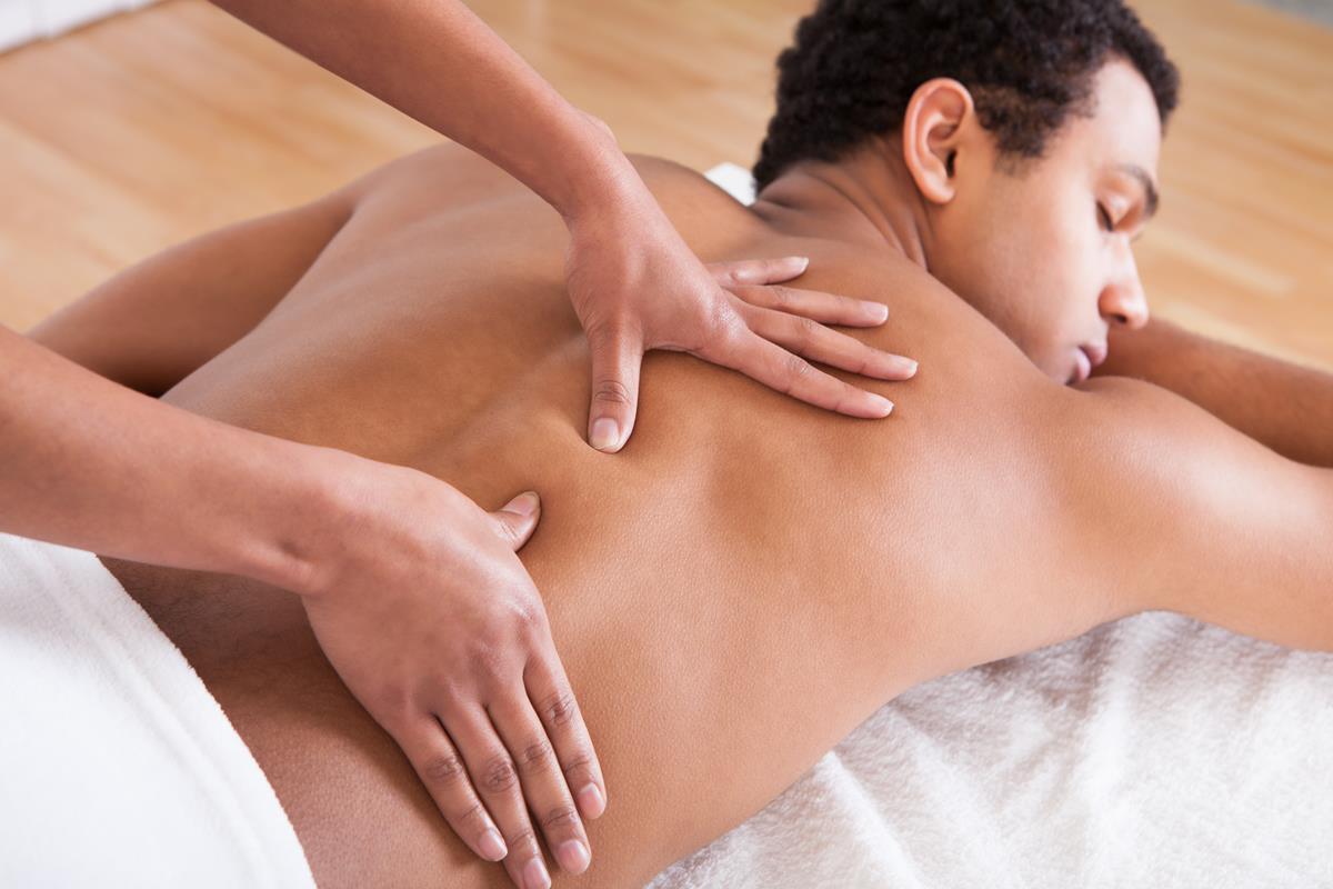 A man getting a back massage at Sabai spa
