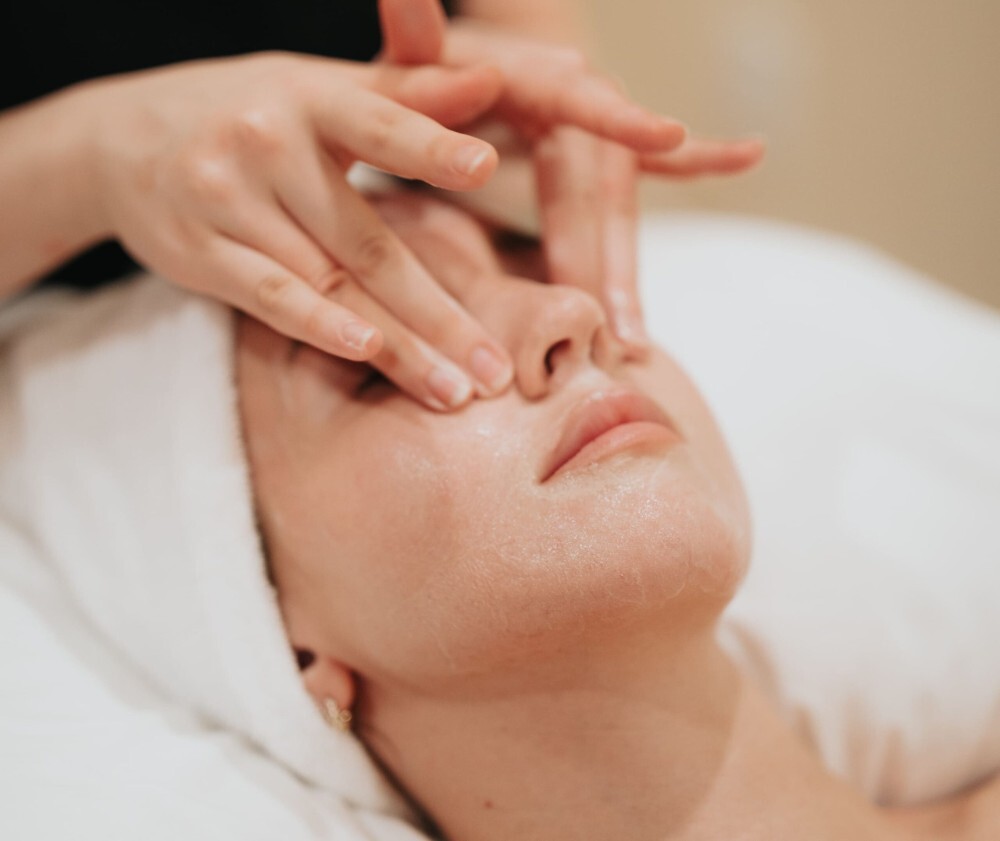Woman Enjoying a Facial Massage