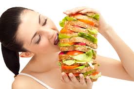 Girl Eating Extra Large Burger