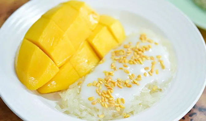 Mango Sticky Rice is a Thai dessert often sold by vendors with street carts in the spring and early summer while mangoes are in season.